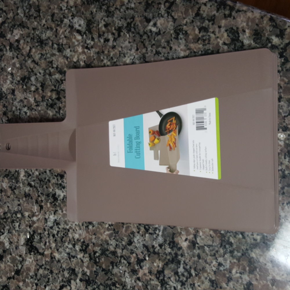 Foldable cutting board new w/tags 8" x 10  light brown color dishwasher safe